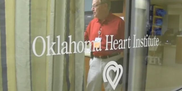 OK Heart Institute logo on glass door